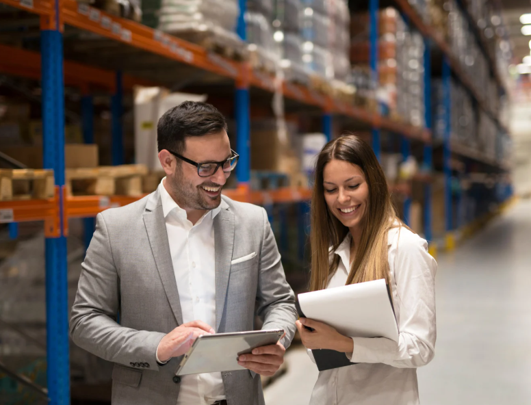 man and woman at industrial warehouse